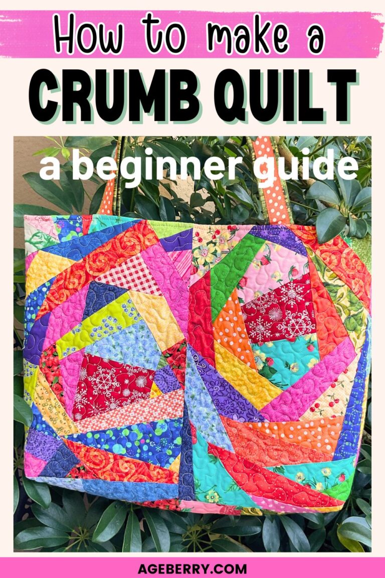Colorful crumb quilt tote bag made from irregular fabric scraps sewn into patchwork blocks. The quilted bag features bright cotton prints, dense quilting, and sturdy orange handles. Text overlay reads “How to make a crumb quilt – a beginner guide.” The image shows how tiny fabric crumbs can be turned into usable quilted fabric for bags and scrap quilting projects.