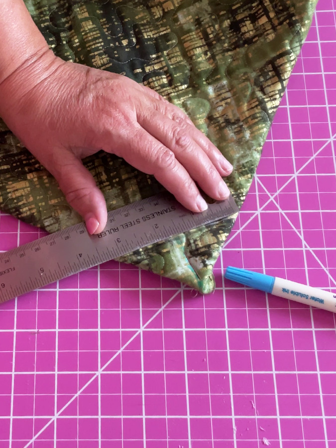 drawing a line at the corner of the bag perpendicular on the side seam