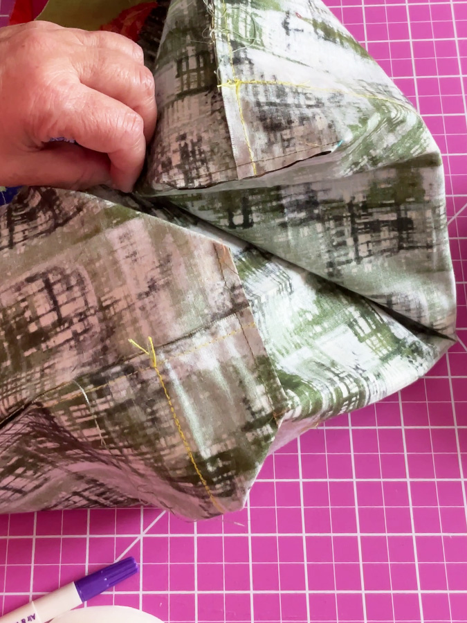 the corners of the bag lining after the proper seam is done and the extra material is cut.