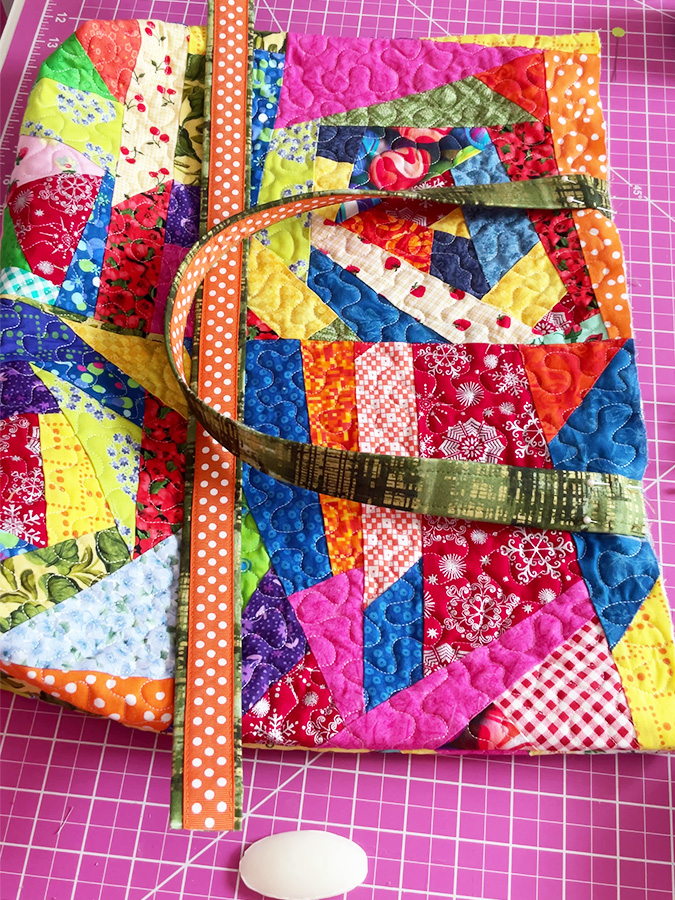 the bag with one handle attached the second waits to be sewn