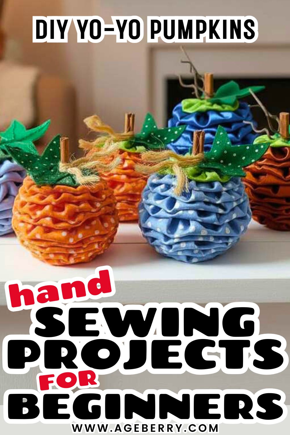 Learn how to make DIY yo-yo pumpkins with a beginner-friendly hand sewing project. The image shows handmade fabric pumpkins created from stacked fabric yo-yos in orange and blue prints, shaped into round pumpkins with gathered layers. Each pumpkin is finished with a cinnamon stick stem, green fabric leaves, and twine accents, displayed on a shelf as cozy fall decor. This hand sewing project for beginners is perfect for using fabric scraps, practicing basic stitches, and creating seasonal autumn decorations for your home.