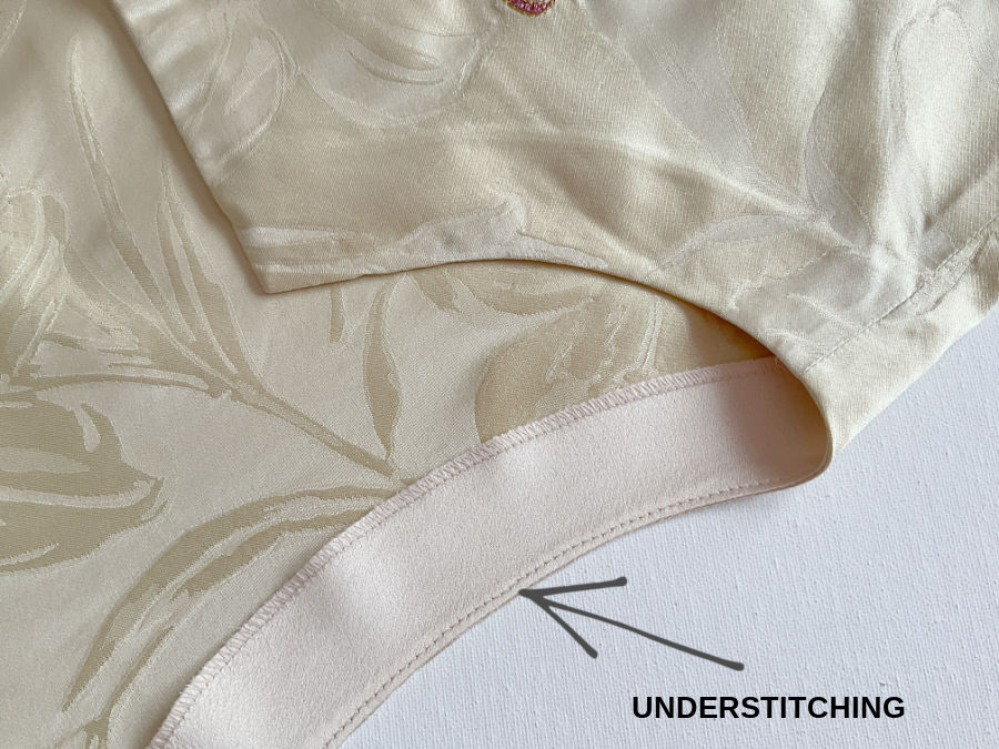 image of the neck bank of a blouse with a seam of stitching labeled understitching