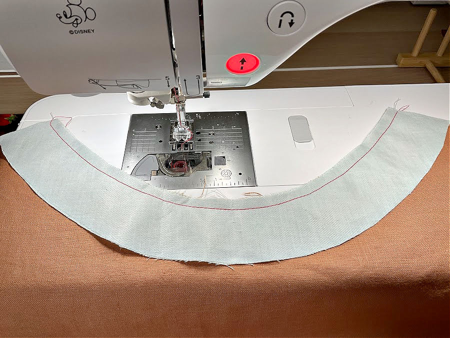 a neck seam on a demo piece of material with contrasting colors to show better the seam the seam allowance is visible and uniform