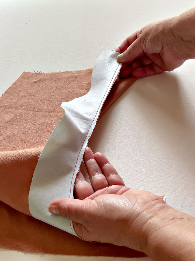 small snips in the seam allowance visible on the neckline curve