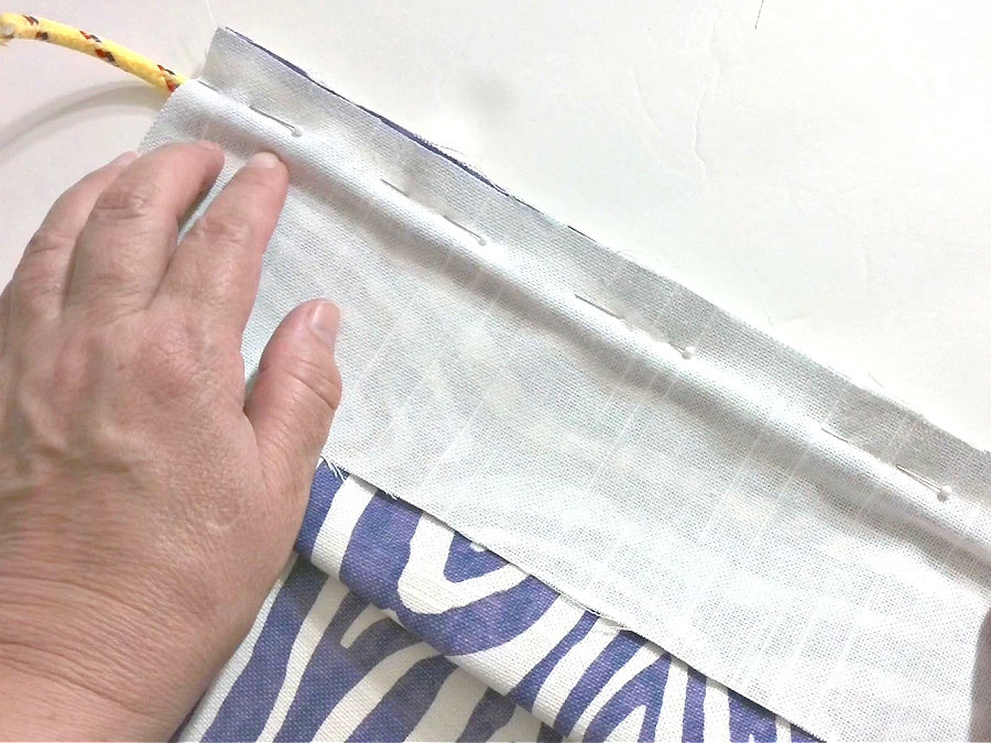 image shows the placement of the second piece of fabric on the piping