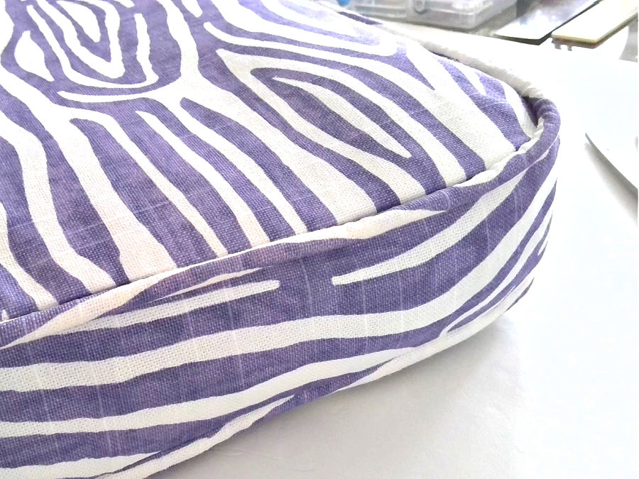 image shows o close up of the curved corner of the chair cushion