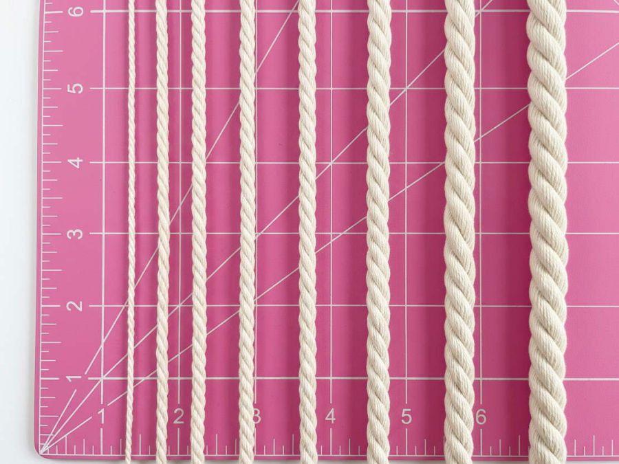 eight different cord sizes from 1/16 inch to 1/2 inch shown aligned on a cutting mat