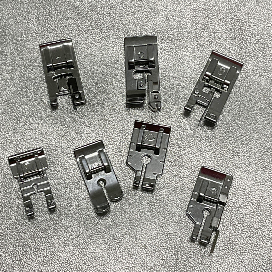 seven obviously different types of sewing machine feet all named quarter inch foot