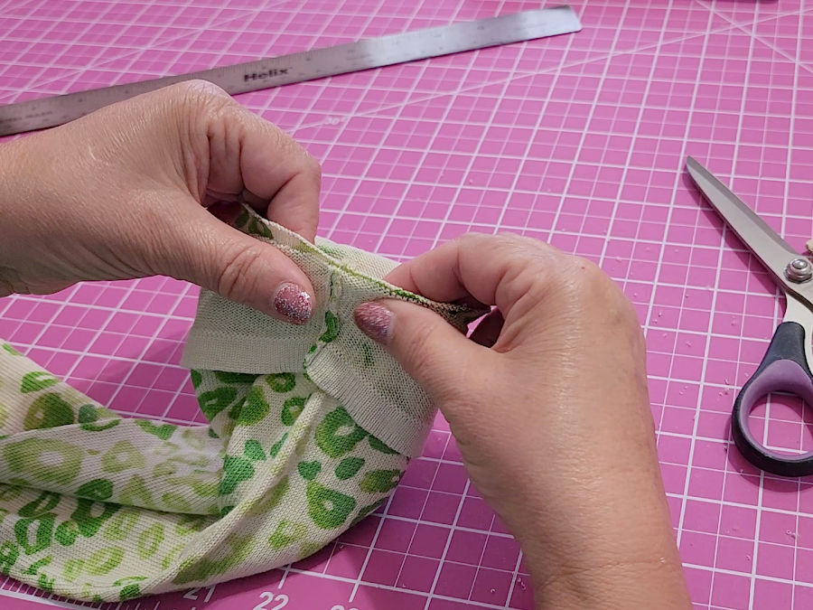 first step in reattaching the band to the rest of the sleeve place the band on the sleeve right sides together