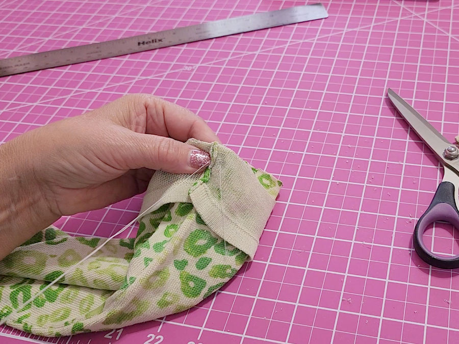basting the band and the sleeve together to avoid shifting while sewing