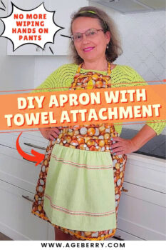 Woman standing in a bright kitchen wearing a handmade apron with a sewn-in towel attached at the front, demonstrating a practical DIY apron design that keeps hands clean while cooking.