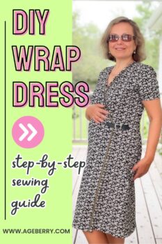 Woman wearing a handmade black wrap dress with a small floral print, shown on a porch, highlighting the wrap front, V-neckline, short sleeves, and waist tie placement during the sewing tutorial process.