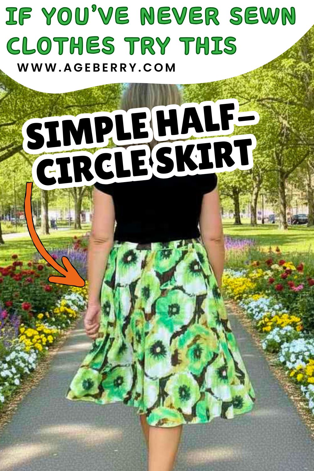 Back view of a woman wearing a green floral half-circle skirt, walking on a paved path lined with colorful flower beds and trees, showing the skirt’s flow and shape from the waist to the hem.