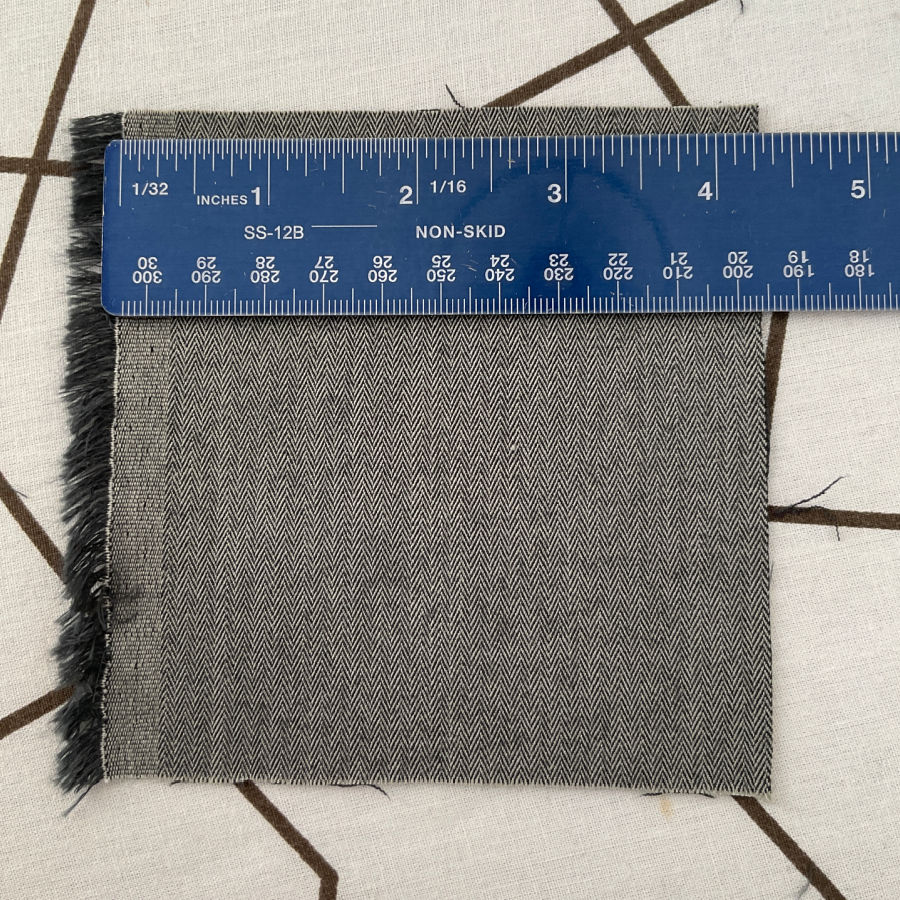 the test square of wool mix fabric shrank almost 1/4 inches after steam pressing