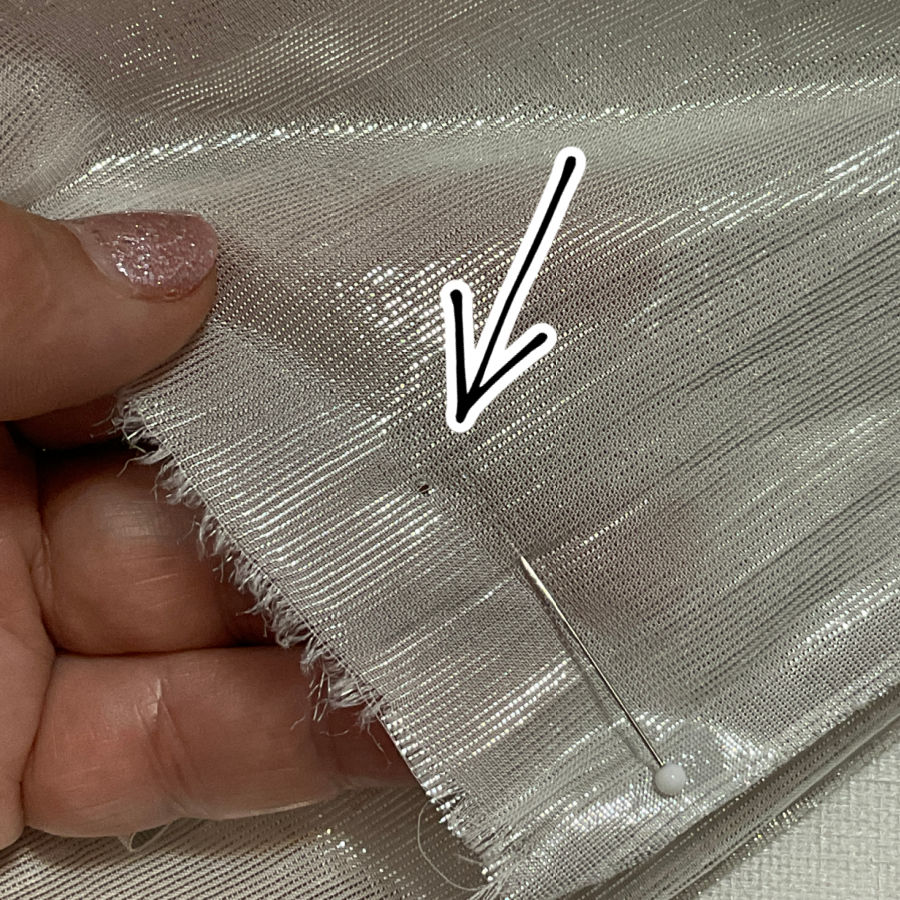 pinhole in the fabric which does not close after the pin was removed