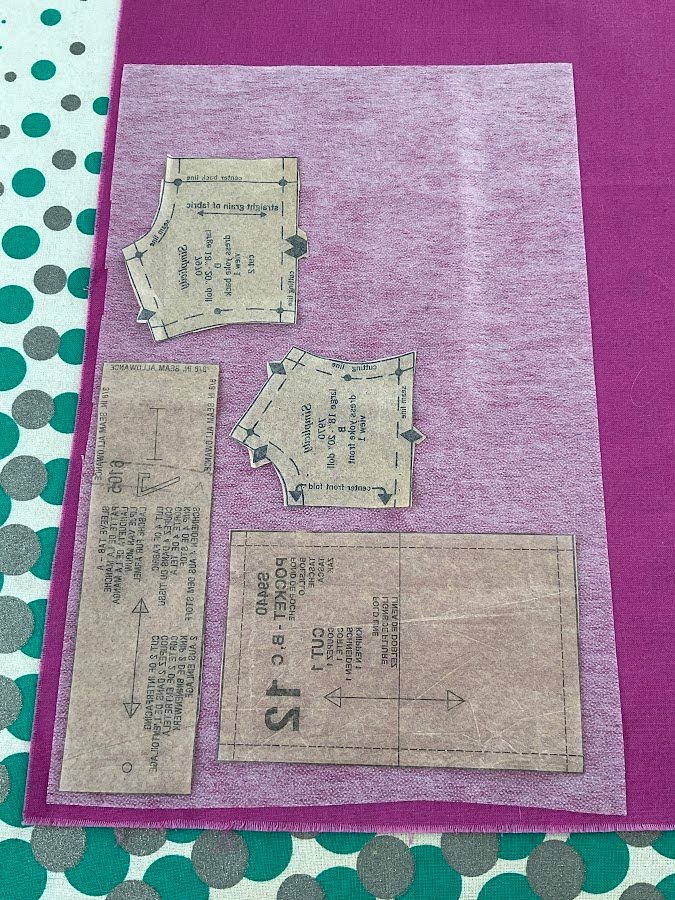 pieces of patter cut and arranged on a piece of material which had fusible interfacing applied to illustrate the block interfacing method