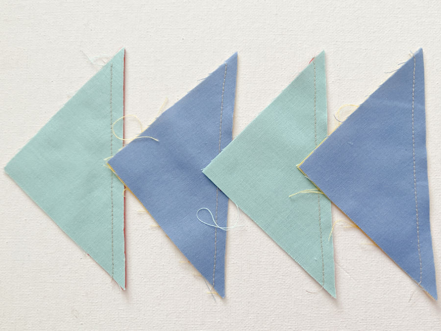 four half square triangles after cutting along the diagonal line