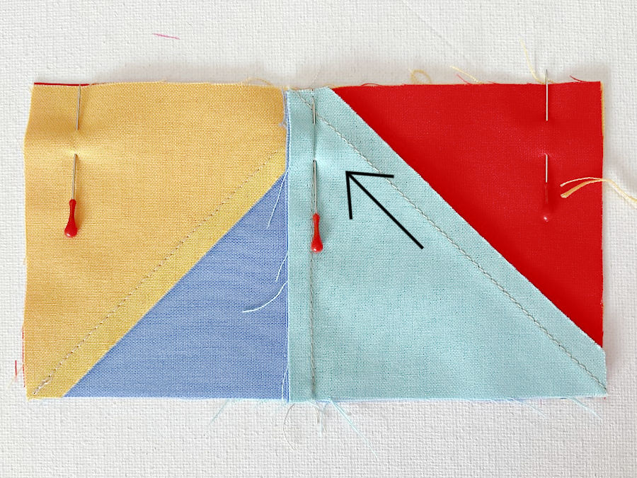 The pin pushed through the seam aligns properly with the seam on one side