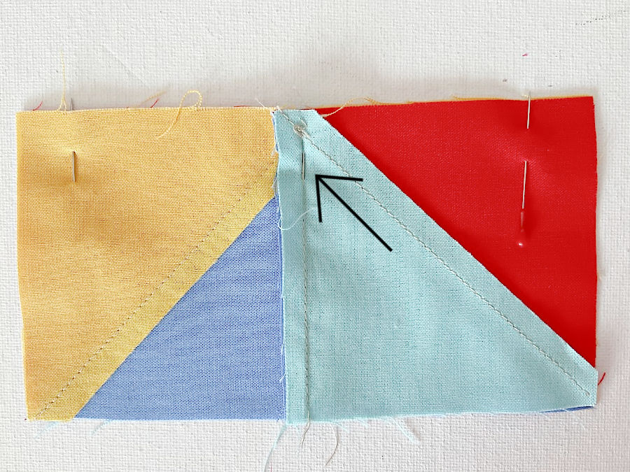 The pin pushed through the seam aligns properly with the seam on the other side