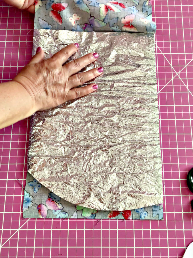 Arranging the thermal batting on top of the cotton batting