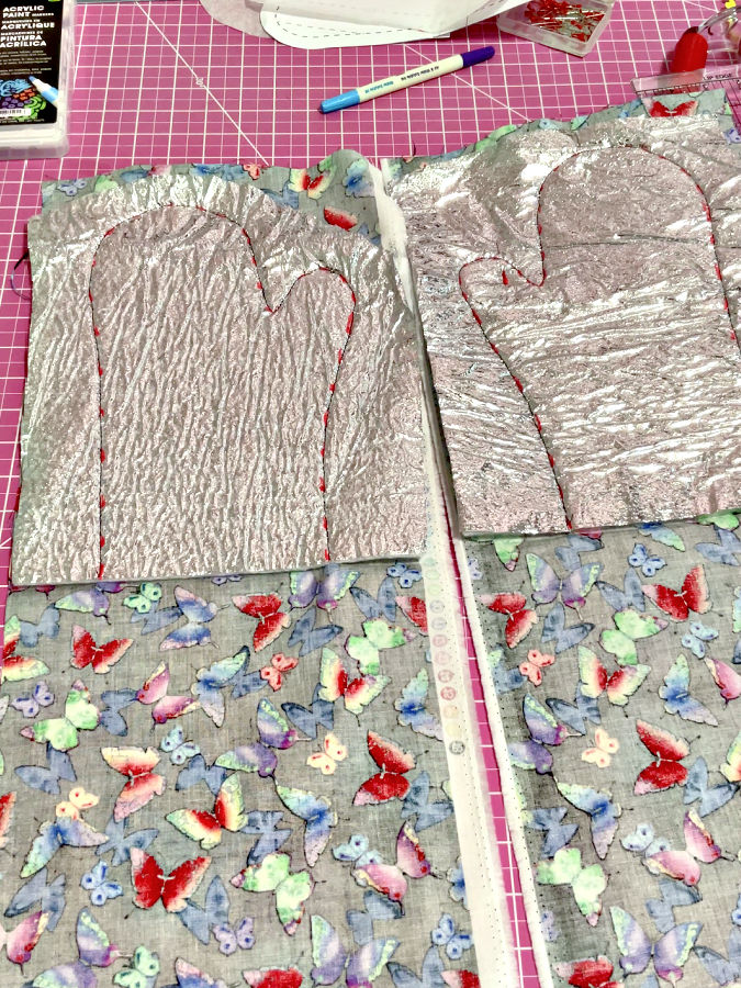 the oven mitt stack after stitching of the mitt contour on the sewing machine