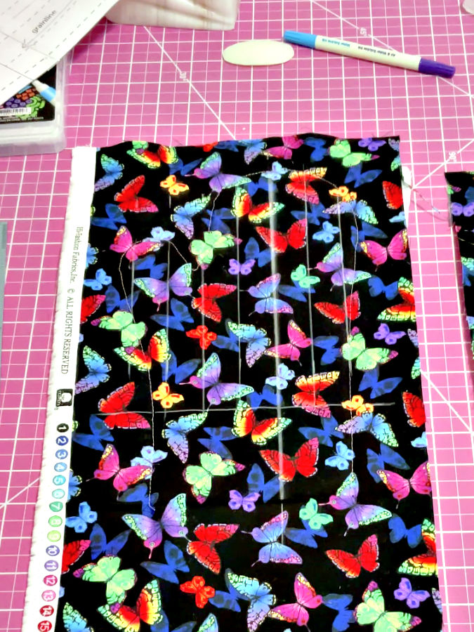 quilting lines drawn on the fabric a marking pen in the background
