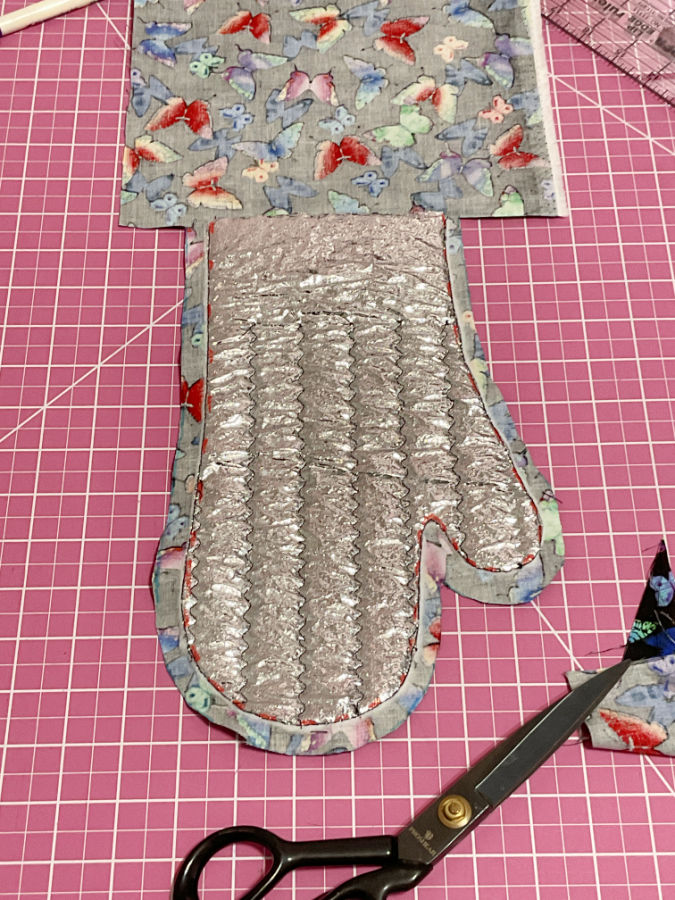 the oven mitt stack after cutting along the seam allowance line notice the top of the image the folded edge line is uncut