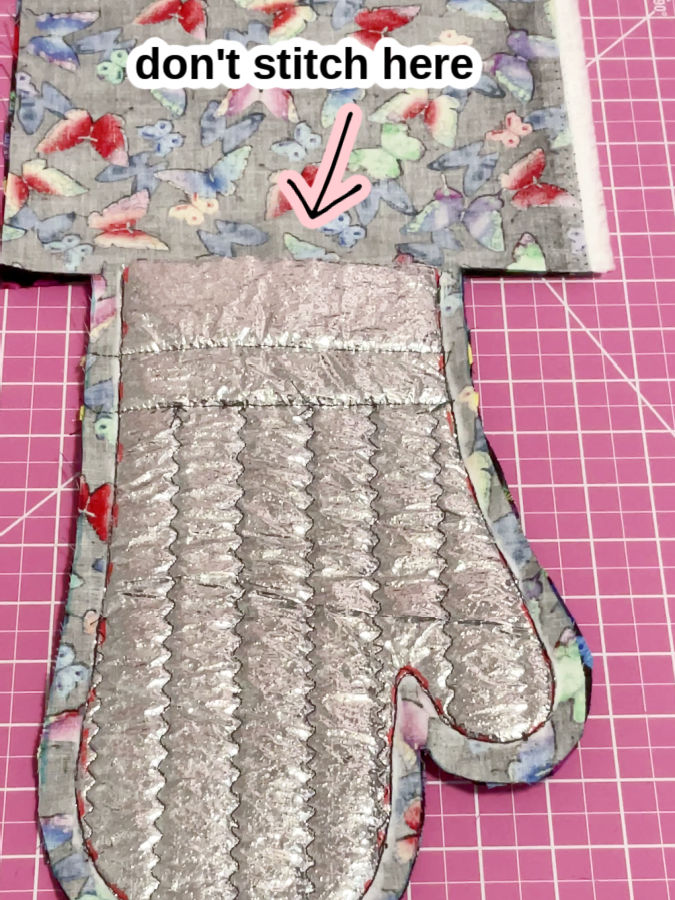 image showing the mitt after stitching with the text "don't stitch here" indicating where the hand opening will be