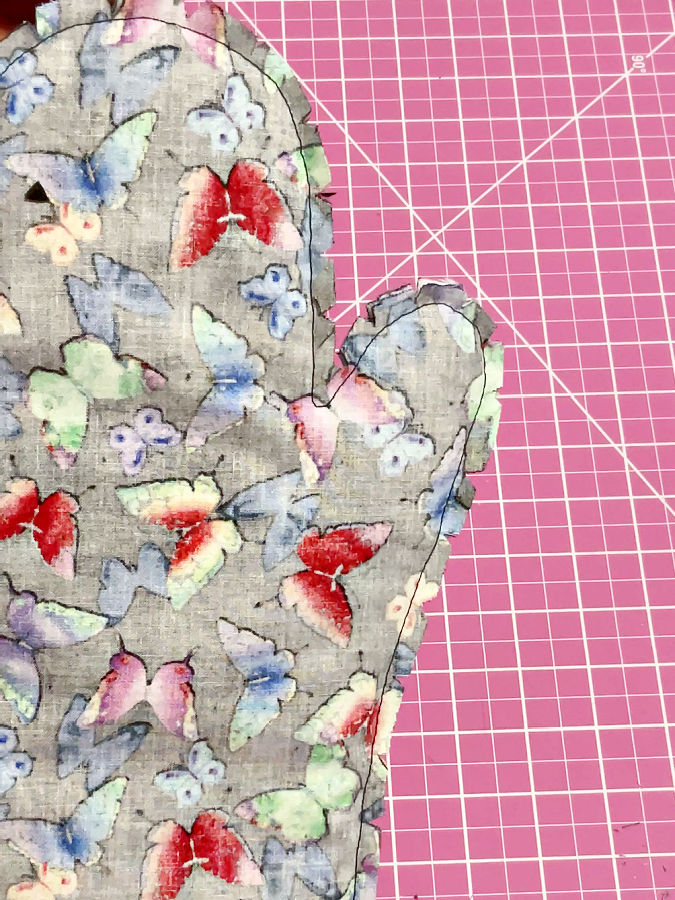 the mitten after cutting the seam allowances and making small notches along the curved edges