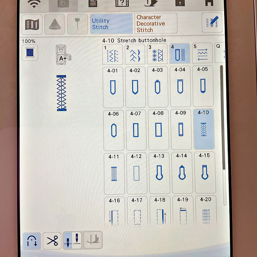 Sewing machine touchscreen displaying utility stitch settings with the stretch buttonhole option selected.