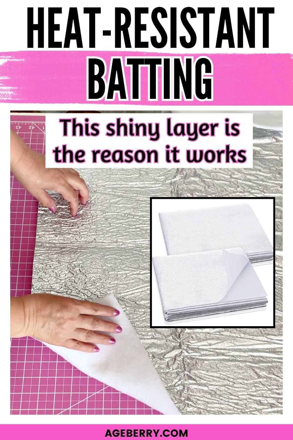 Hands lifting a piece of heat resistant batting with a shiny reflective layer on a pink cutting mat, showing the silver side and white backing