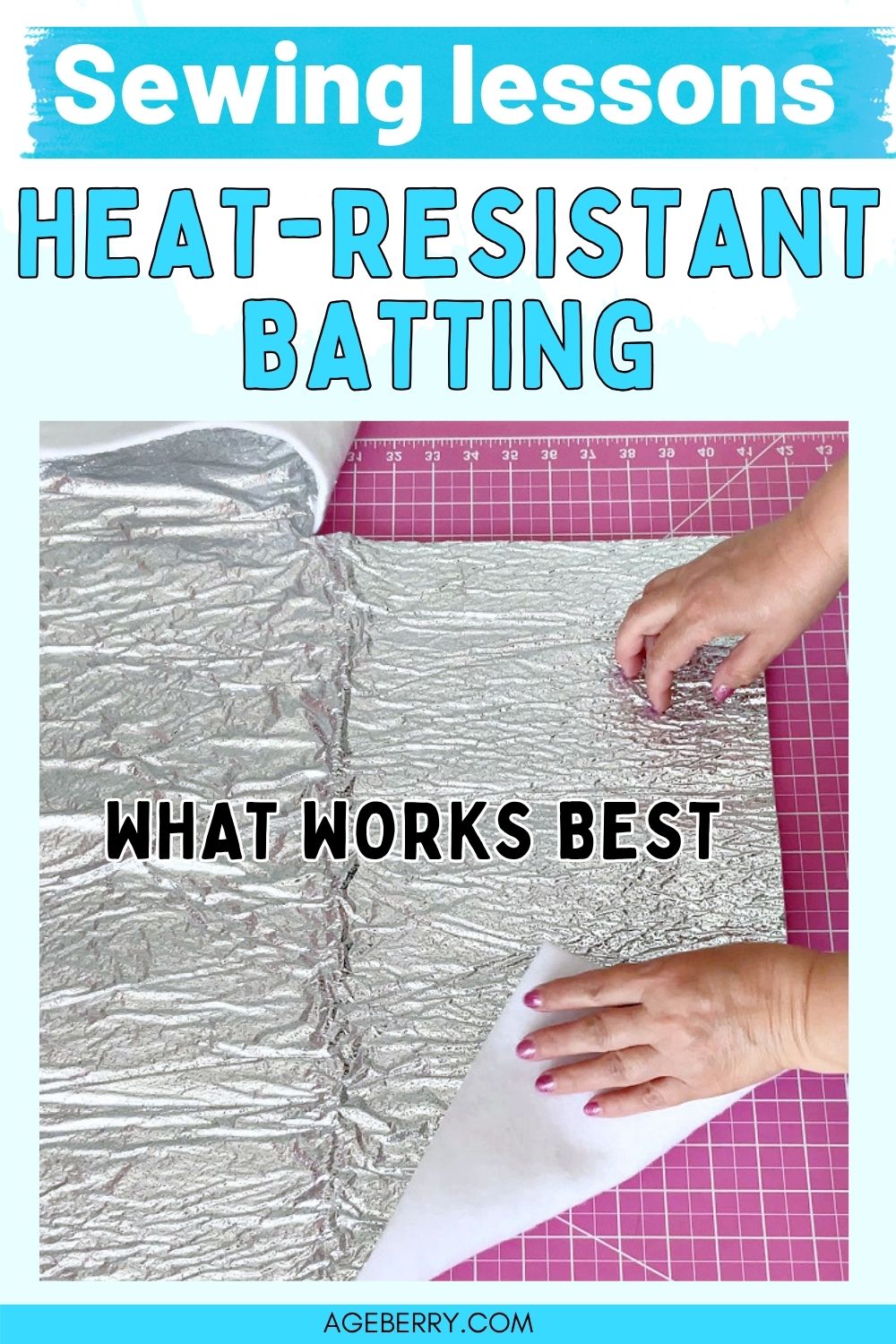Heat resistant batting with metallic reflective surface spread on a cutting mat, with hands lifting one corner to show the layered structure
