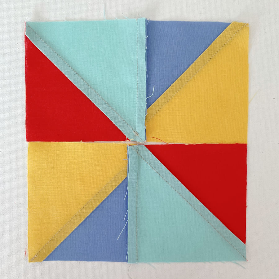 the two rectangular units seen from the wrong side the diagonal seams and seam allowances are visible