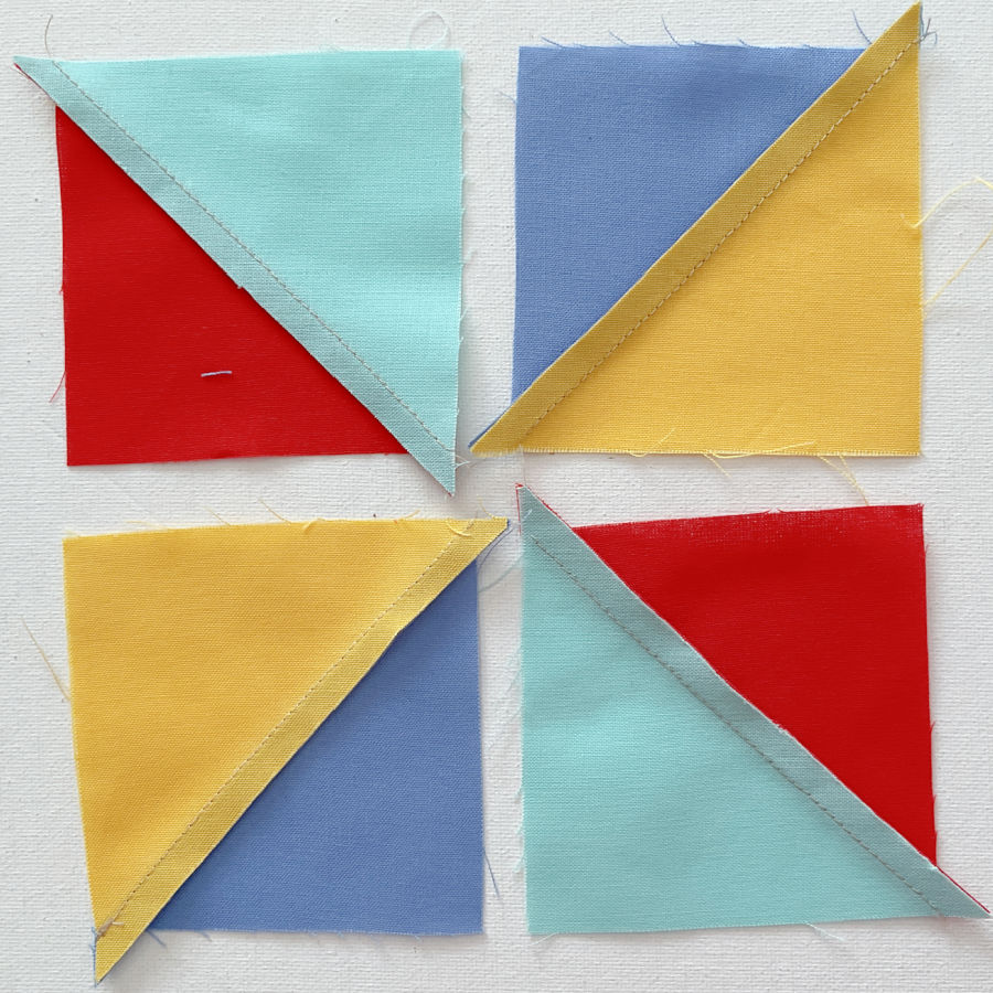 half square triangles showing the uncut dog ears corners