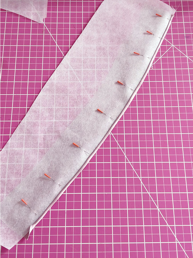 using pins to keep the material from shifting after folding