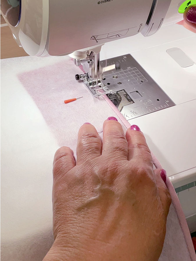Stay consistent with your distance from the edge this stitching secures the hem and gives it a neat, even look from the right side.