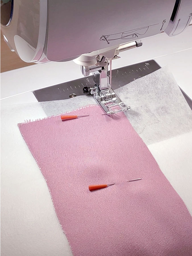 starting stitching the material to the stabilizer