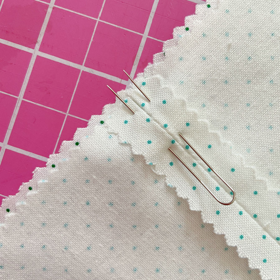 placing the fork pin in the fabric after matching the seam using a single pin method