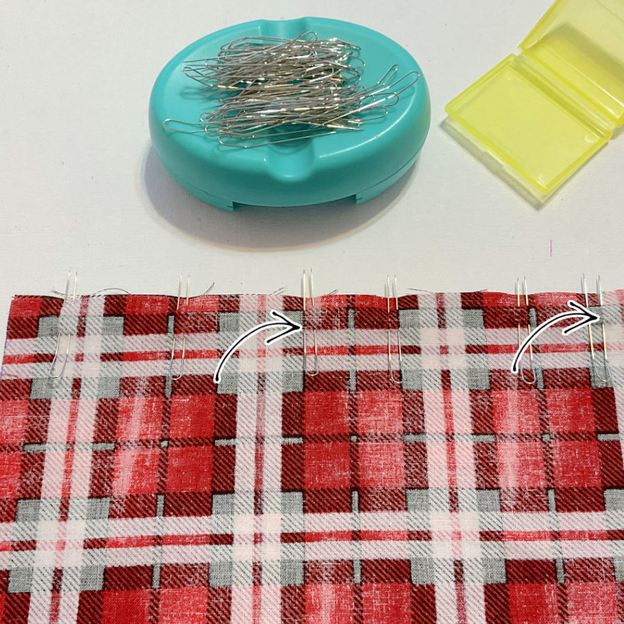 inserting fork pins to match two pieces of plaid fabric
