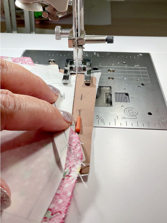 stitching the pieces 3 and 4 close to the paper edge