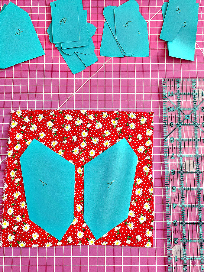 temp;ate parts arranged on a piece of fabric for cutting