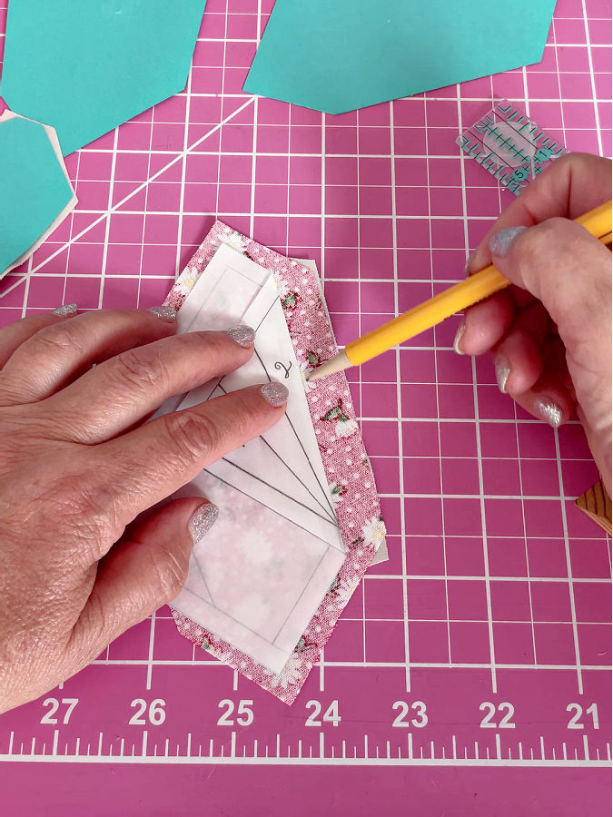 folding the paper between the pieces 1 and 2