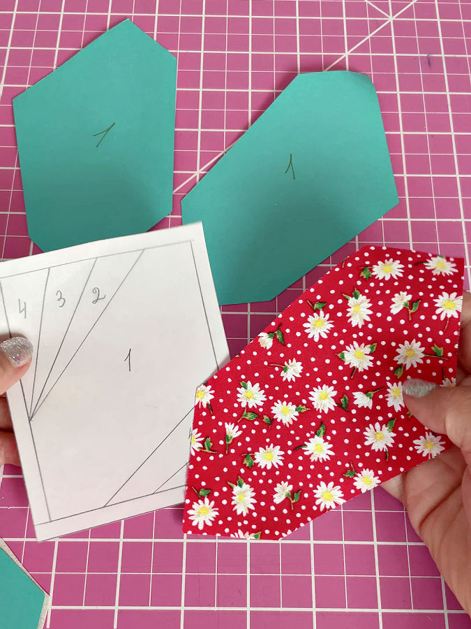 arranging the first piece of fabric on the tenmplate