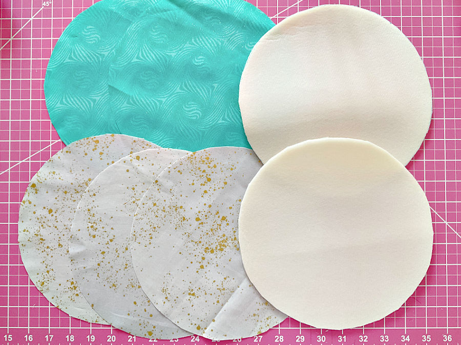 all circular parts for the purse sides already cut sitting on a cutting mat