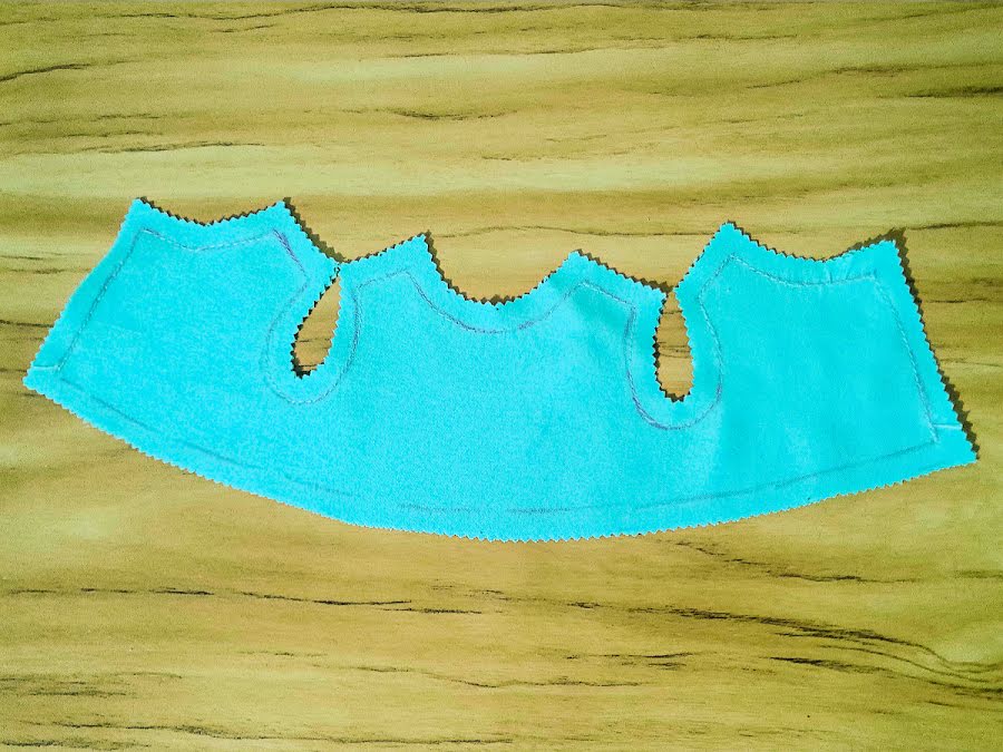 a piece of the bussy doll dress whish was sewn with the method sew first cut after the seam allowance is visible