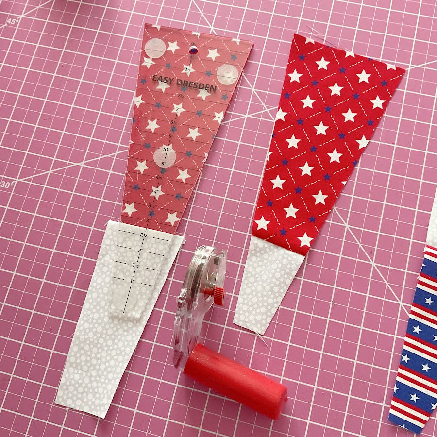 image showing the alignment for the dresden pattern on the red/white blade and the result after cutting from this pattern a rotary cutter also seen in the image