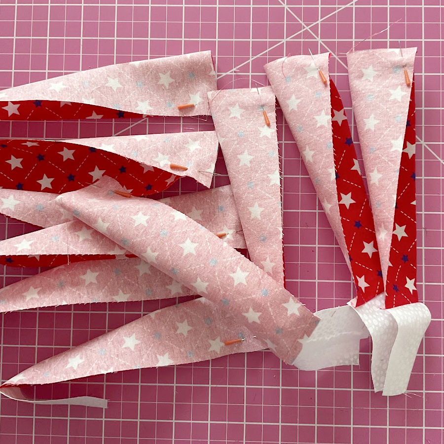 the red blades folded at the wide edge and pinned