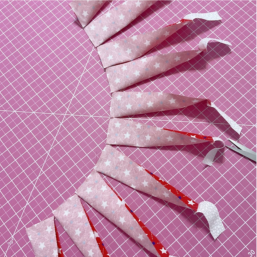 the red blades sewn together in a chain at the wide edge