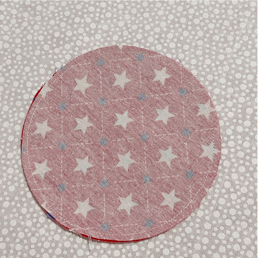 two circles from the red material sewn right sides together without any opening