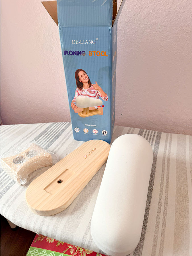 image of the box and parts for the ironing board the label on the box is ironing stool